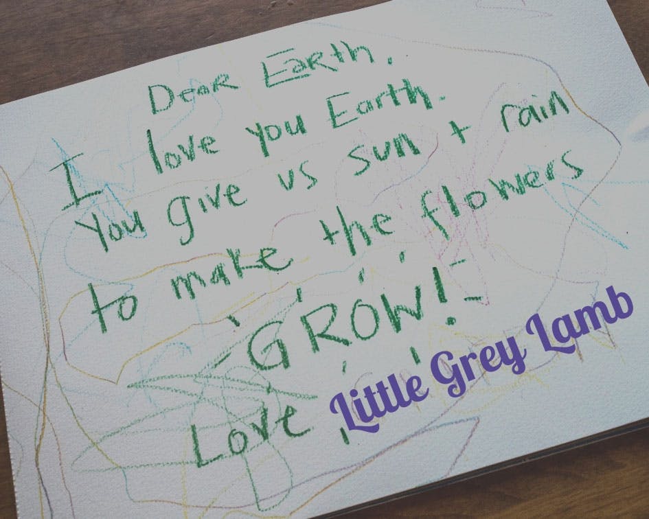 A love letter to Earth, in green crayon on thick paper, written by the author Brianna Sharpe’s child.